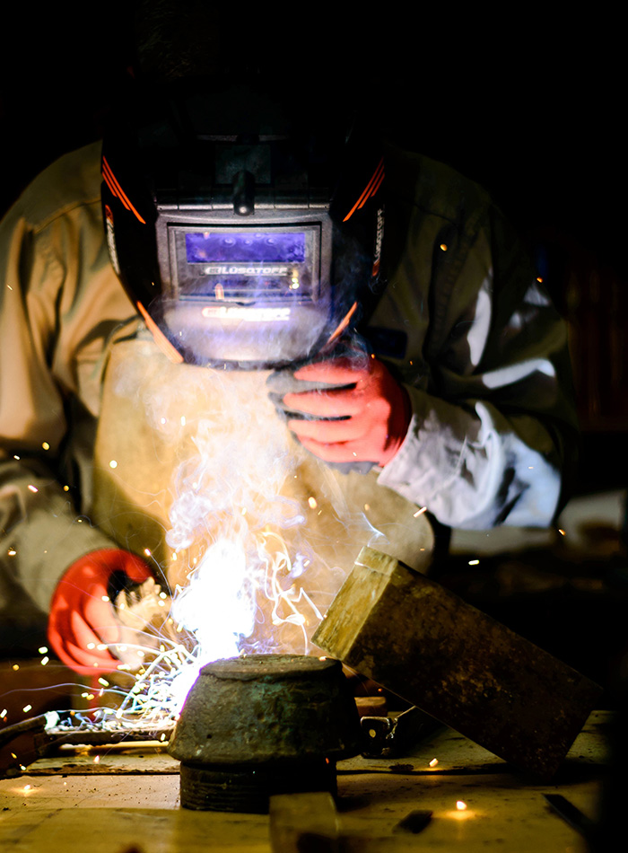 person-wearing-a-helmet-and-welding person-wearing-a-helmet-and-welding